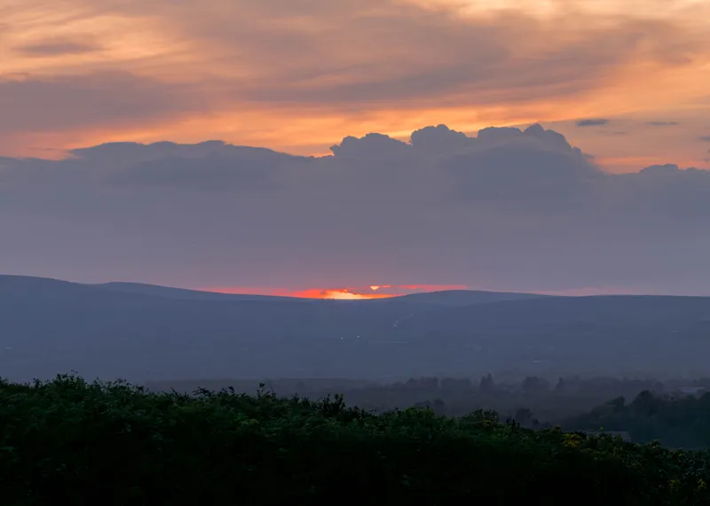 Sunset glow over distant hills